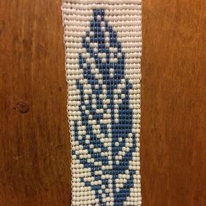 Beaded feather bracelet with extension